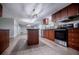 Spacious kitchen features modern appliances, an island, and wood-look flooring at 300 Old Boy Scout Rd, Whitesburg, GA 30185