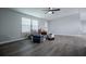 Another view of the living room, showcasing ample space and natural light at 300 Old Boy Scout Rd, Whitesburg, GA 30185