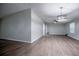 Bright living room features wood-look floors and modern lighting at 300 Old Boy Scout Rd, Whitesburg, GA 30185