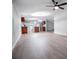 Open-concept living and kitchen area with wood-look floors and natural light at 300 Old Boy Scout Rd, Whitesburg, GA 30185