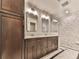 Bathroom with double vanity, marble countertop, and patterned tile in walk-in shower at 3771 Club Nw Dr, Kennesaw, GA 30144