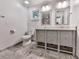 Bathroom featuring double vanity with undermount sinks, tile floor, and built in storage at 3771 Club Nw Dr, Kennesaw, GA 30144