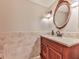 Elegant powder room with a decorative mirror and a marble countertop at 3771 Club Nw Dr, Kennesaw, GA 30144
