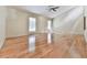 Spacious bedroom with hardwood floors, two windows with blinds, and a ceiling fan at 3771 Club Nw Dr, Kennesaw, GA 30144