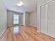 Bedroom featuring hardwood floors, natural light, and double sliding closet doors at 3771 Club Nw Dr, Kennesaw, GA 30144