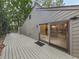 Large wooden deck featuring access to the house through sliding glass doors at 3771 Club Nw Dr, Kennesaw, GA 30144