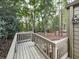 An elevated wooden deck is surrounded by trees and natural landscaping at 3771 Club Nw Dr, Kennesaw, GA 30144