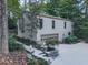 Charming home features a private driveway, landscaping, and a side entry garage at 3771 Club Nw Dr, Kennesaw, GA 30144