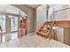 Open foyer featuring wood stairs with metal railing, and tile floor at 3771 Club Nw Dr, Kennesaw, GA 30144