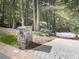 Stone mailbox and driveway entrance, surrounded by lush trees at 3771 Club Nw Dr, Kennesaw, GA 30144
