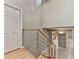 Bright hallway features hardwood floors, modern metal stair rail and an open view to the kitchen area at 3771 Club Nw Dr, Kennesaw, GA 30144