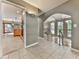 Bright hallway featuring tile floors, open access to the kitchen and living room at 3771 Club Nw Dr, Kennesaw, GA 30144