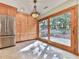 The kitchen features a stainless steel refrigerator, generous cabinet space, and a sliding glass door to the back yard at 3771 Club Nw Dr, Kennesaw, GA 30144