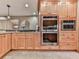 This kitchen features stainless steel appliances, and tile backsplash at 3771 Club Nw Dr, Kennesaw, GA 30144