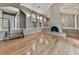 Bright living room featuring hardwood floors and a unique arched fireplace at 3771 Club Nw Dr, Kennesaw, GA 30144