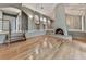 Inviting living room featuring hardwood floors and a unique arched fireplace at 3771 Club Nw Dr, Kennesaw, GA 30144