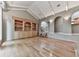 Spacious living room with built-in shelving, hardwood floors, and a staircase at 3771 Club Nw Dr, Kennesaw, GA 30144