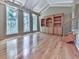 Living room boasting hardwood floors, built-in shelving, and vaulted ceilings at 3771 Club Nw Dr, Kennesaw, GA 30144