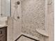 Walk-in shower featuring white marble tile and a built-in corner seat at 3771 Club Nw Dr, Kennesaw, GA 30144
