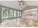 Sunroom featuring tile floors, vaulted ceiling and an open archway to the kitchen at 3771 Club Nw Dr, Kennesaw, GA 30144