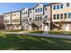 Exterior view of new construction townhouses highlighting stone accents and inviting covered entrances at 3774 Jack Vernon Cir, Powder Springs, GA 30127