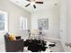 Bright office featuring a glass desk, modern decor, and a comfortable reading chair at 3774 Jack Vernon Cir, Powder Springs, GA 30127