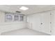 Finished basement with carpet, window, and door to hall at 630 Dana Pointe Ct, Lawrenceville, GA 30045