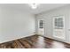 Bright and airy bedroom with two windows and hardwood floors at 630 Dana Pointe Ct, Lawrenceville, GA 30045
