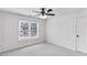 Cozy bedroom with carpet, natural light from window, and a ceiling fan at 630 Dana Pointe Ct, Lawrenceville, GA 30045