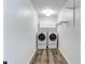 Functional laundry room with a washer, dryer, and storage cabinets at 630 Dana Pointe Ct, Lawrenceville, GA 30045