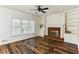 Bright living room with hardwood floors, fireplace, and built-in shelving, creating a cozy and inviting space at 630 Dana Pointe Ct, Lawrenceville, GA 30045