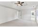 Spacious main bedroom with neutral carpet and ensuite bathroom, offering a serene retreat with modern conveniences at 630 Dana Pointe Ct, Lawrenceville, GA 30045