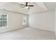 Open, bright main bedroom with trey ceiling, neutral carpet, and natural light, creating a peaceful sanctuary at 630 Dana Pointe Ct, Lawrenceville, GA 30045