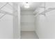 Walk-in closet offers ample storage space with multiple shelves at 630 Dana Pointe Ct, Lawrenceville, GA 30045