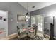 Cozy breakfast nook with a glass-top table, chairs, and a view of the backyard at 1258 Rocky Branch Trl, Lawrenceville, GA 30043