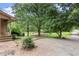 Exterior home view surrounded by mature trees and natural landscaping creating a serene setting at 129 Bill Smith Dr, Canton, GA 30114