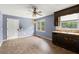 Kitchen area with white trim door, original dark cabinets, and natural light, offering a cozy space at 129 Bill Smith Dr, Canton, GA 30114