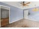 Blue living room with brick-look floors and a chandelier at 129 Bill Smith Dr, Canton, GA 30114