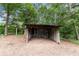 Exterior view of backyard shed featuring metal siding, providing outdoor storage at 129 Bill Smith Dr, Canton, GA 30114