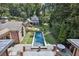 Beautiful backyard with long pool, stone patio, and landscaped lawn at 2883 Andrews Nw Dr, Atlanta, GA 30305