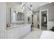 Bathroom with marble countertops, dual sinks, a shower, and large vanity at 2883 Andrews Nw Dr, Atlanta, GA 30305