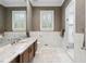 Bathroom featuring marble countertops, dual sinks, and walk-in shower at 2883 Andrews Nw Dr, Atlanta, GA 30305