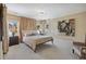 Bedroom featuring a king-size bed, windows, and carpet at 2883 Andrews Nw Dr, Atlanta, GA 30305