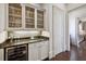 Butler's pantry featuring granite countertop, wine fridge, and glass cabinet at 2883 Andrews Nw Dr, Atlanta, GA 30305