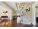Elegant foyer with winding staircase, wood floors, and decorative lighting at 2883 Andrews Nw Dr, Atlanta, GA 30305