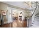 Grand foyer with hardwood floors, winding staircase, and sophisticated decor at 2883 Andrews Nw Dr, Atlanta, GA 30305