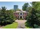 Stately brick home with manicured landscaping and circular driveway for curb appeal at 2883 Andrews Nw Dr, Atlanta, GA 30305