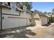 Spacious three-car garage with ample parking and storage space on a sunny day at 2883 Andrews Nw Dr, Atlanta, GA 30305