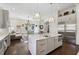 Open kitchen featuring stainless steel appliances, an island, and modern lighting at 2883 Andrews Nw Dr, Atlanta, GA 30305