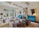 Open-concept living room with fireplace, floor-to-ceiling windows, and modern lighting at 2883 Andrews Nw Dr, Atlanta, GA 30305